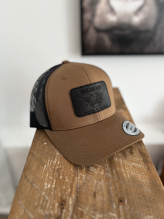 Brown coyote black leather cap