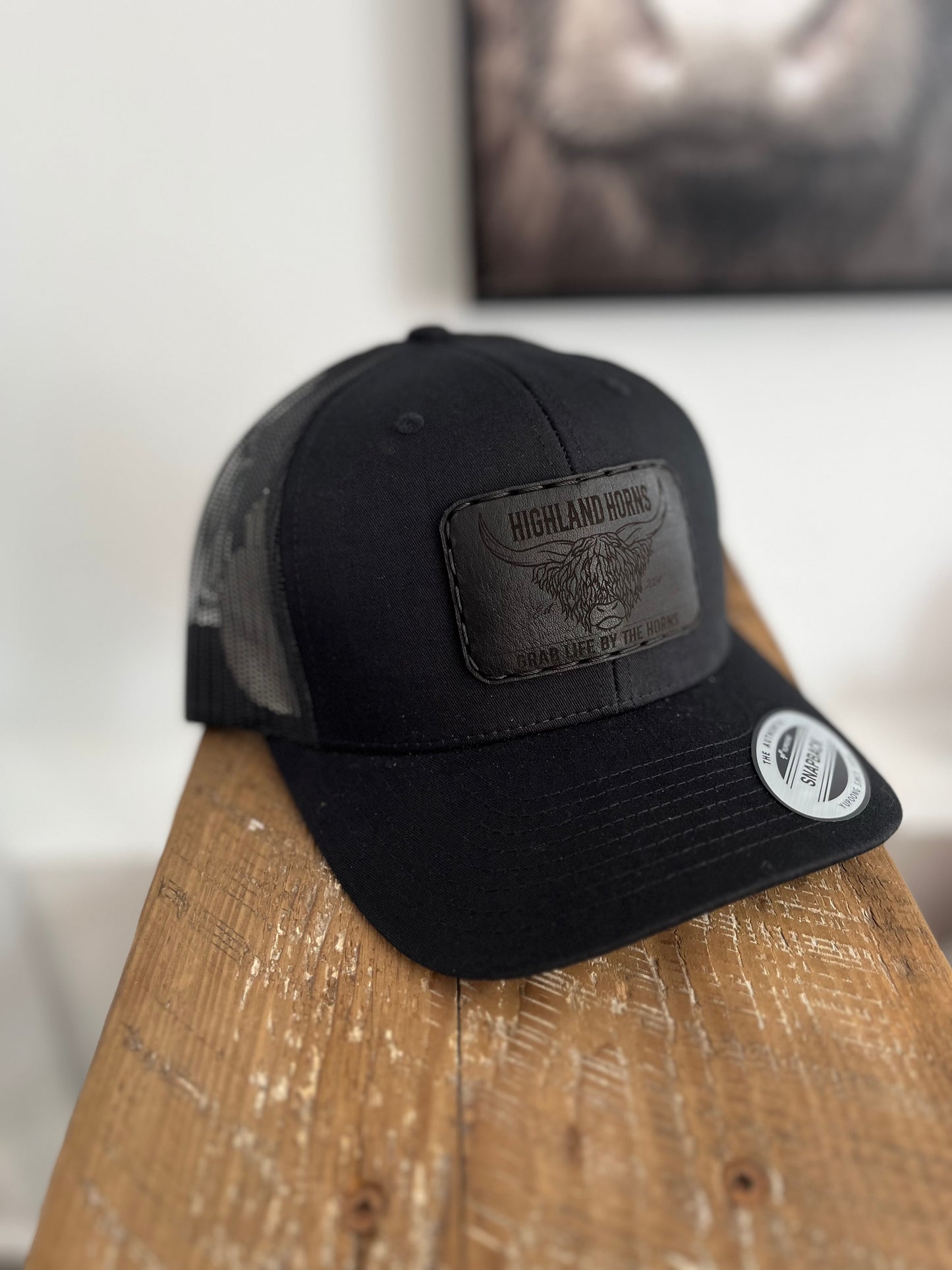 Black leather black cap